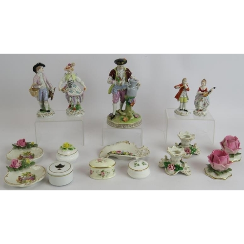 141 - A collection of Dresden and other porcelain including two pairs of figures, a single figure, two pai... 