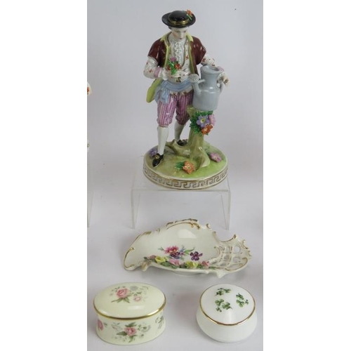 141 - A collection of Dresden and other porcelain including two pairs of figures, a single figure, two pai... 