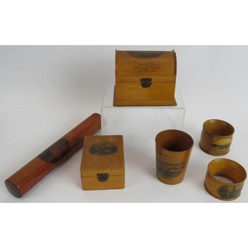 142 - A small collection of Mauchline ware including trinket boxes, napkin rings, beaker and pen holder, p... 