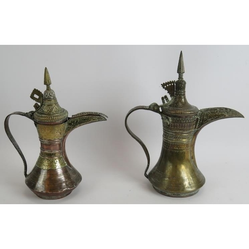 148 - Two antique copper and brass middle Eastern Dallah coffee pots, both intricately decorated. Tallest ... 