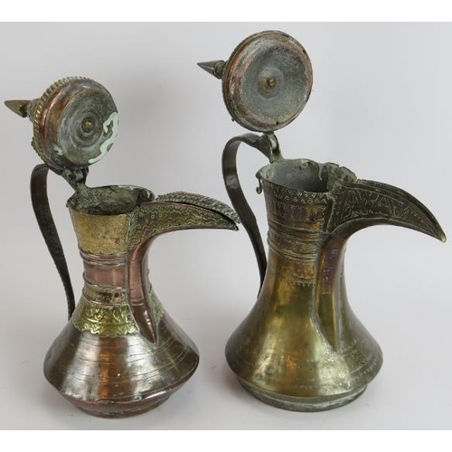 148 - Two antique copper and brass middle Eastern Dallah coffee pots, both intricately decorated. Tallest ... 