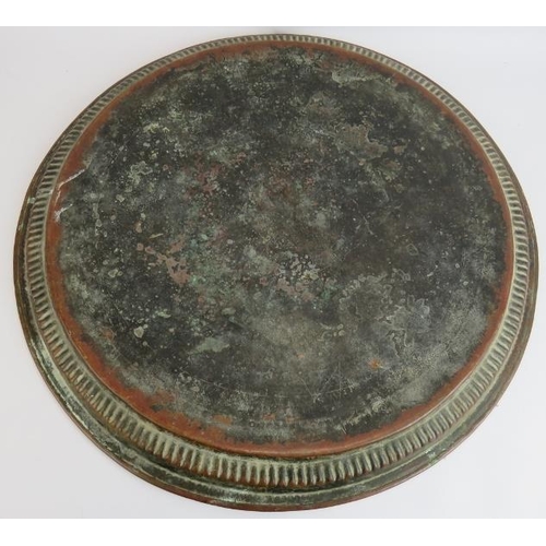 150 - Two large copper middle Eastern chargers, the largest signed to reverse, diameter 58cm, plus a coppe... 