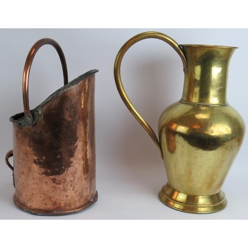 152 - An antique copper coal scuttle with rivetted handles and a large brass water jug. 50cm tall. (2).
Co... 