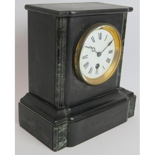 153 - A small antique slate mantel clock with enamelled dial. Key and pendulum present. Height 23cm.
Condi... 