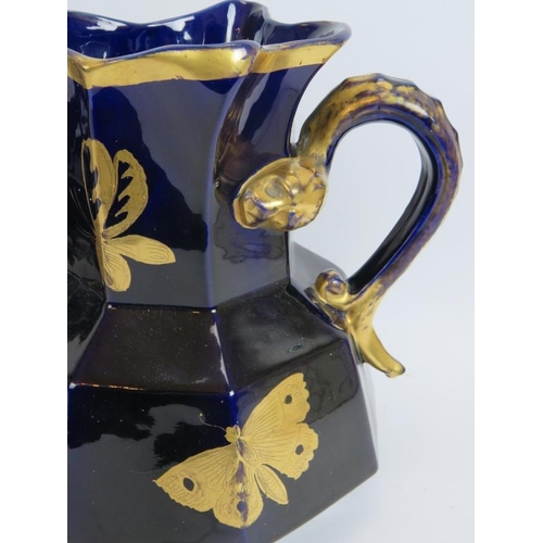 161 - An antique aesthetic movement blue jug and bowl set with gilt butterfly and insect decoration and an... 