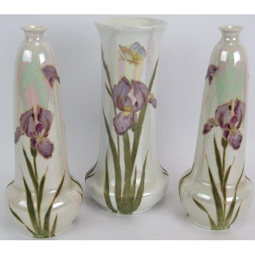 166 - An early 20th century pearl lustre vase by Gebruder Heubach hand decorated with irises and two match... 