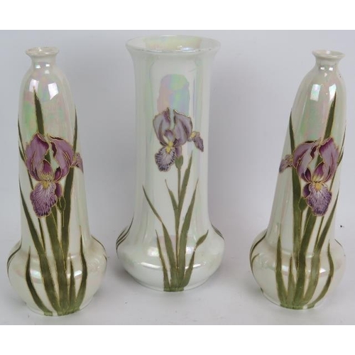 166 - An early 20th century pearl lustre vase by Gebruder Heubach hand decorated with irises and two match... 