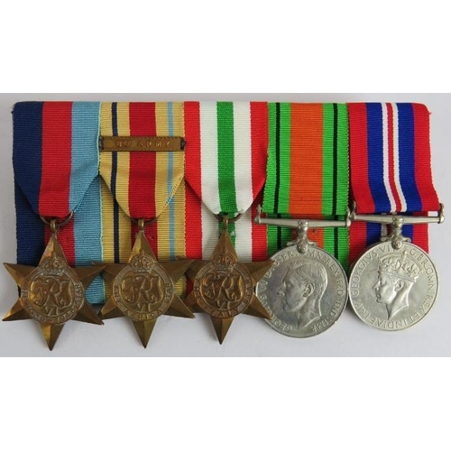 176 - A WW2 medal group on brooch bar including 1939-1945 star, African star with 8th army clasp, Italy st... 