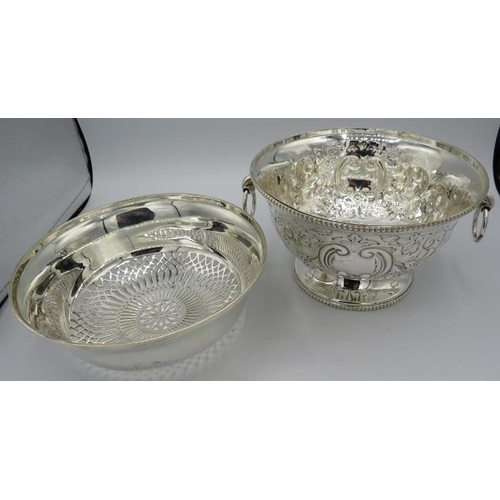 184 - A silver plated embossed rose bowl with ring handles and a silver plated strainer bowl.
Condition re... 