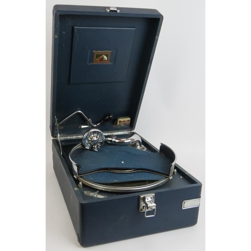 185 - A vintage portable HMV gramophone in blue leatherette case. 41cm x 29cm.
Condition report: Winds and... 