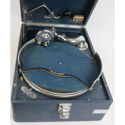 185 - A vintage portable HMV gramophone in blue leatherette case. 41cm x 29cm.
Condition report: Winds and... 