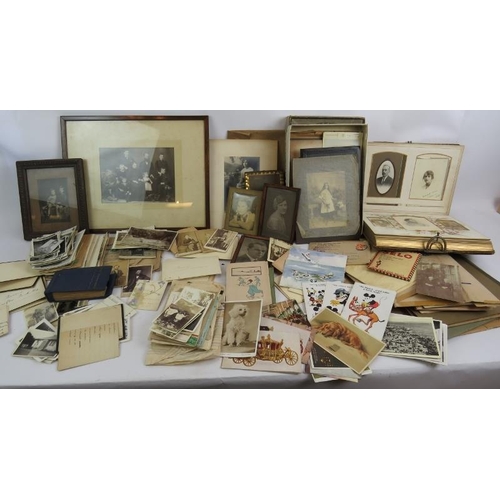 187 - A large collection of photos, postcards, greetings cards, letters and other ephemera, late 19th cent... 