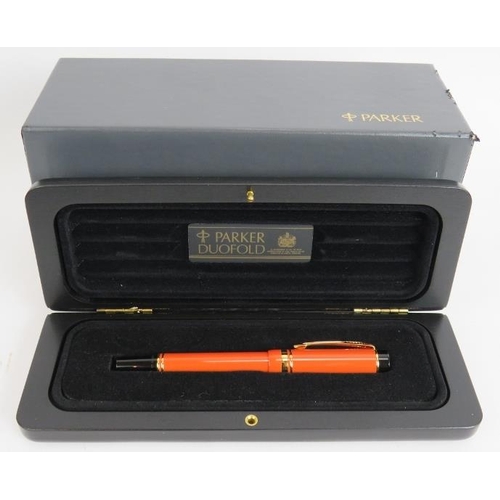 19 - A 1980s Parker Duo Fold International fountain pen, brand new old stock. Orange body, 18ct gold nib,... 