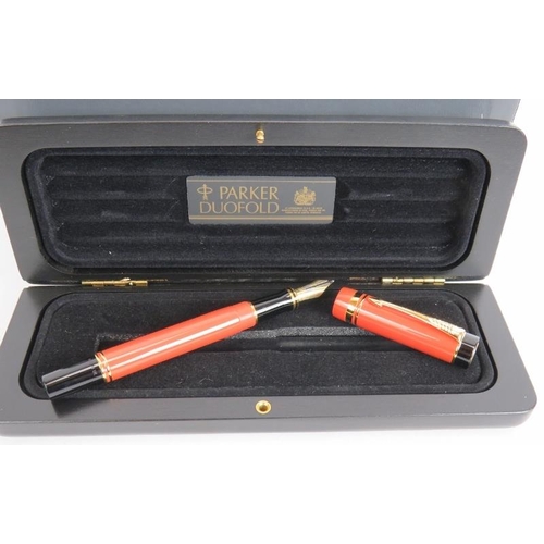 19 - A 1980s Parker Duo Fold International fountain pen, brand new old stock. Orange body, 18ct gold nib,... 