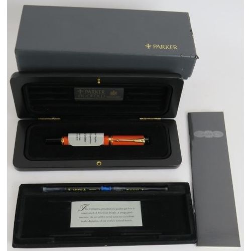 19 - A 1980s Parker Duo Fold International fountain pen, brand new old stock. Orange body, 18ct gold nib,... 