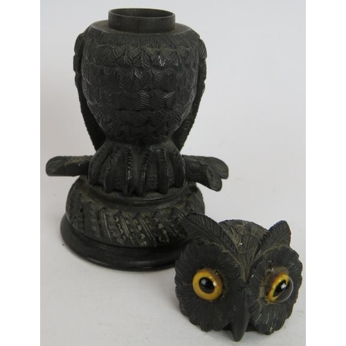 196 - An antique Irish bog oak table vesta match holder in the form of an owl with glass eyes, a pair of g... 