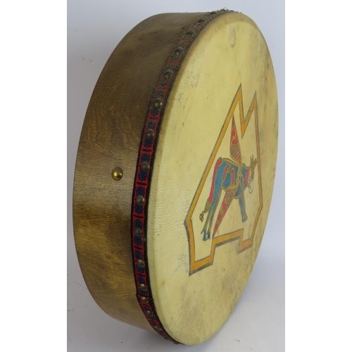 237 - An Irish Bodhrán drum with hand painted winged cow decoration. 46 cm diameter.
Condition report: Som... 