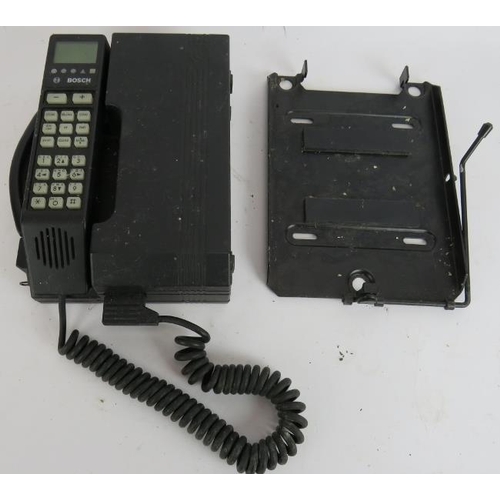 238 - A 1980s Bosch CP007 car phone with mounting bracket.
Condition report: Untested. Sold as seen.