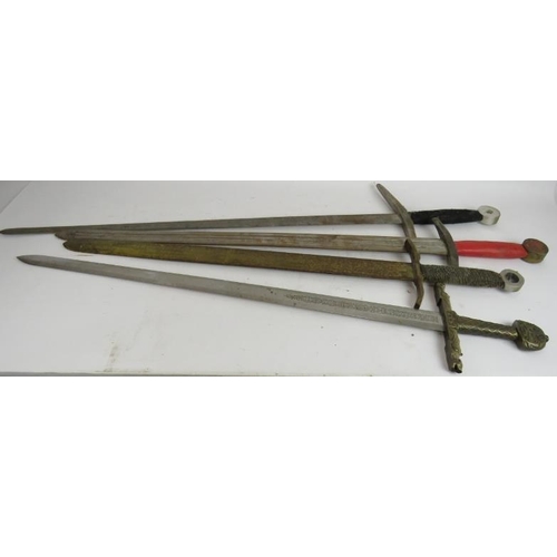 242 - Four medieval style replica swords for display or re-enactment, one with ornate bronze hilt and etch... 