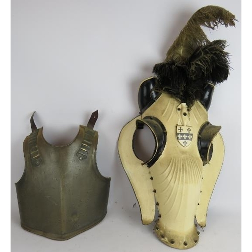 244 - A steel replica armour breast plate, a pair of similar leg armour plates and a composite breast plat... 