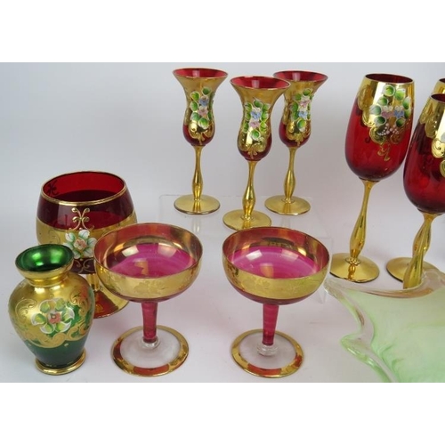 249 - A mixed lot of highly decorated glassware including wine glasses, coupes, lemonade set, vases and a ... 