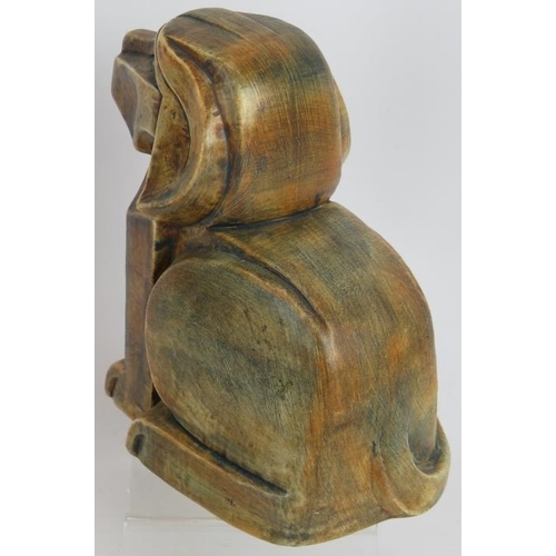 25 - A 20th century Cubist/Art Deco pottery dog with brushed glaze. Unsigned. Height 14.5cm.
Condition re... 