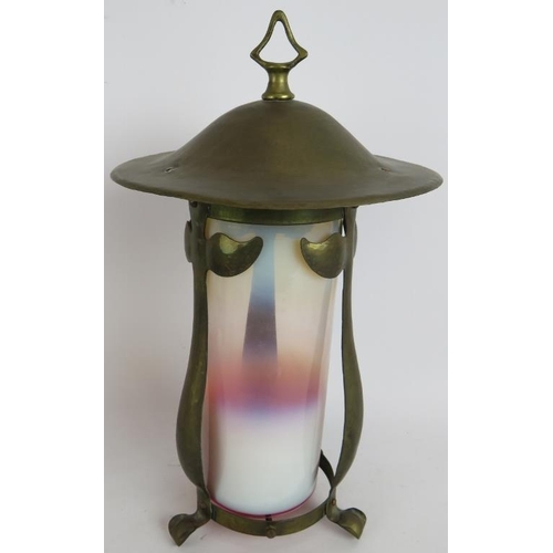 27 - An early 20th century Arts & Crafts style brass lantern with graduated milk glass shade and planishe... 