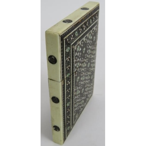 270 - An antique Indo-Persian card case decorated with bone and metal micro-mosaics. 10cm x 7.5cm.
Conditi... 