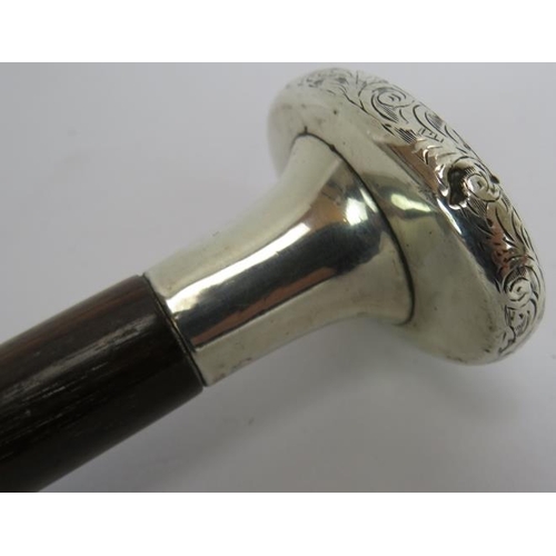 271 - An early 20th century walking cane with hallmarked silver handle, (London 1916) inset with two Mothe... 