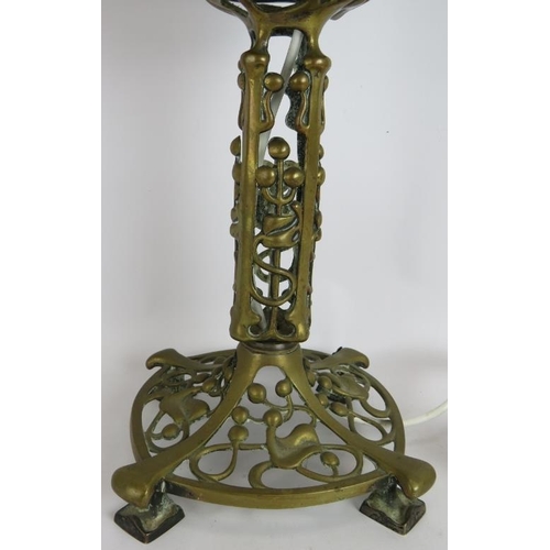 28 - An Art Nouveau cast brass oil lamp with ivy and berry patterned base later converted to electricity.... 