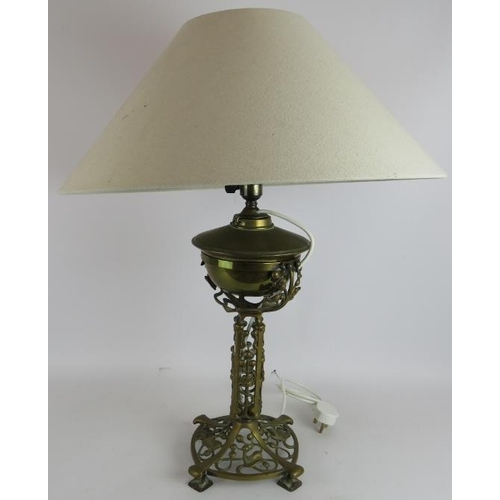 28 - An Art Nouveau cast brass oil lamp with ivy and berry patterned base later converted to electricity.... 