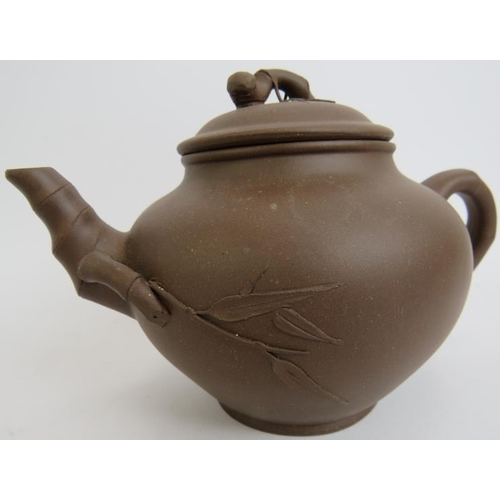 280 - A Chinese Yixing teapot with lid, relief moulded with bamboo decoration, impressed mark to underside... 