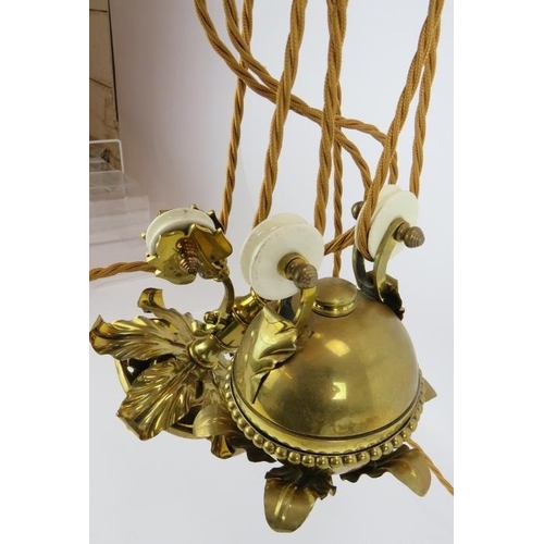 288 - A period brass Art Nouveau two lamp rise and fall ceiling light with acanthus leaf decoration. Width... 