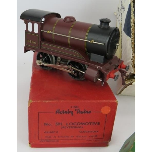 289 - A vintage clockwork Hornby 0 Gauge No 501 locomotive, a No 1 milk traffic van, an LNER carriage, No ... 