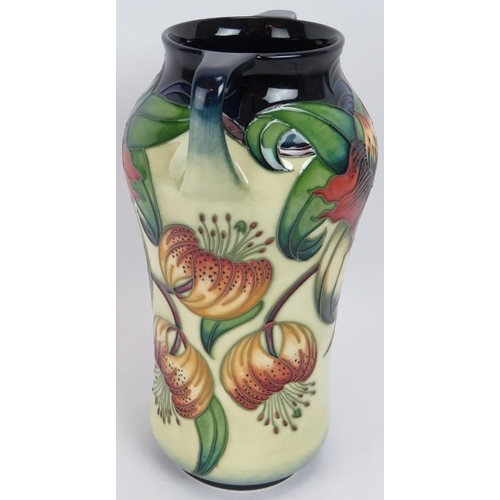 294 - A two handled Moorcroft pottery vase in Anna Lily design, height 26.5cm.
Condition report: No issues... 