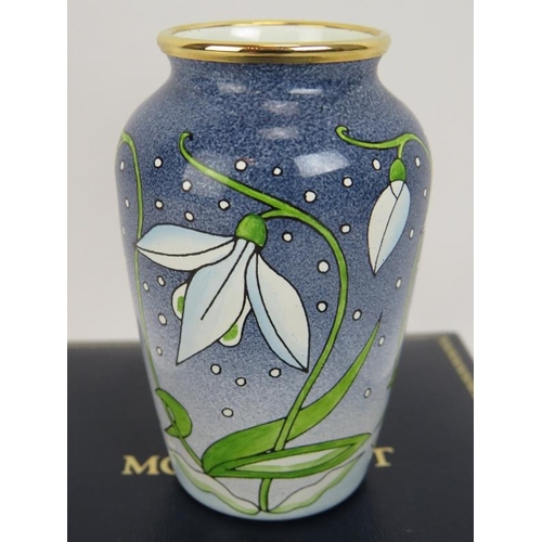 295 - A miniature Moorcroft enamel vase with snowdrop decoration in presentation case. Height 7cm.
Conditi... 