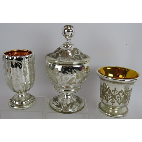 32 - Six pieces of antique continental mercury glass including two cups and saucers, three goblets and a ... 