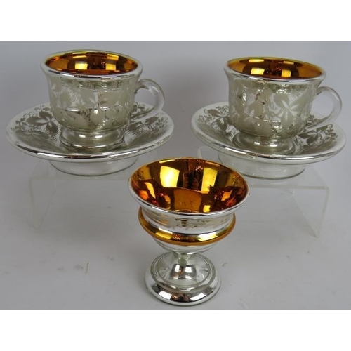 32 - Six pieces of antique continental mercury glass including two cups and saucers, three goblets and a ... 