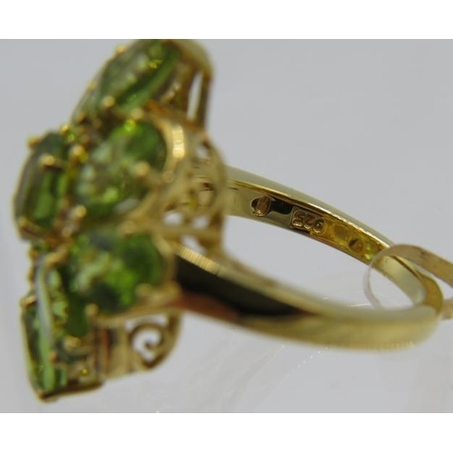 331 - Peridot statement ring, large 27mm x 22mm setting, oval faceted stones of good colour, clarity, cut ... 