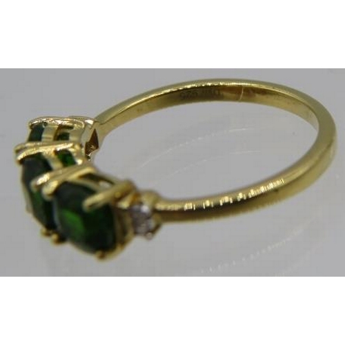 335 - Faceted cushion cut Russian diopside & baguette diamond ring, size N/O. 14k yellow gold/925.
Conditi... 