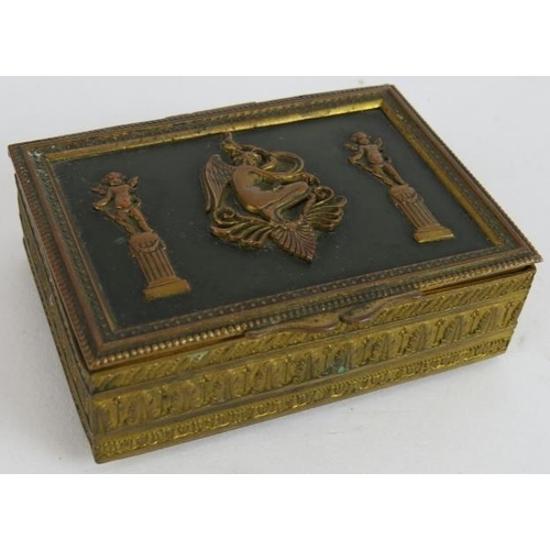 36 - A small French Empire Revival gilt brass trinket box with green velvet lining. 8cm x 6cm x 2.5cm.
Co... 