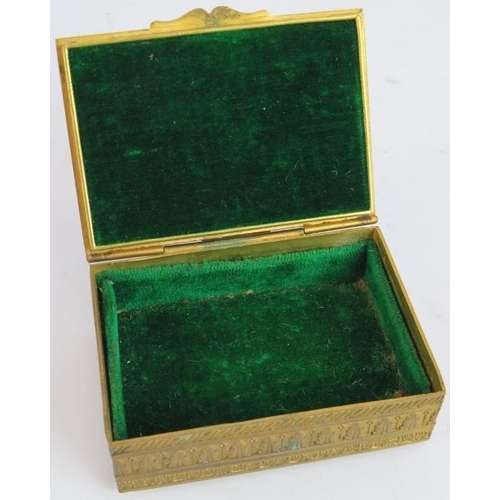 36 - A small French Empire Revival gilt brass trinket box with green velvet lining. 8cm x 6cm x 2.5cm.
Co... 