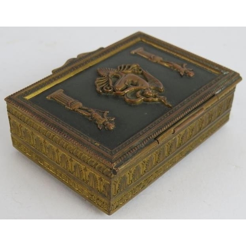 36 - A small French Empire Revival gilt brass trinket box with green velvet lining. 8cm x 6cm x 2.5cm.
Co... 