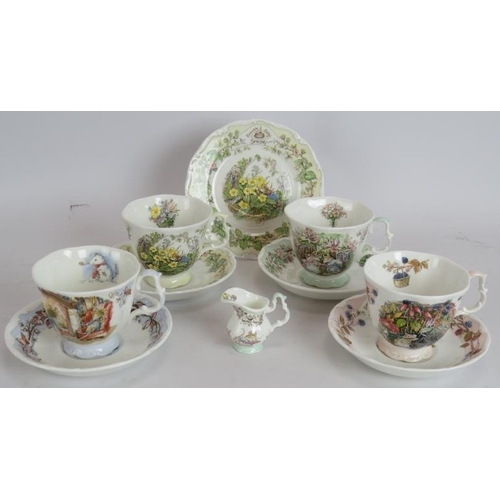 41 - A Royal Doulton Brambly Hedge four seasons part tea set consisting four cups and saucers, one plate ... 