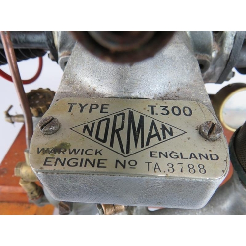 47 - A vintage Norman type T300 stationery engine on wood block mount. Height 68cm.
Condition report: Unt... 