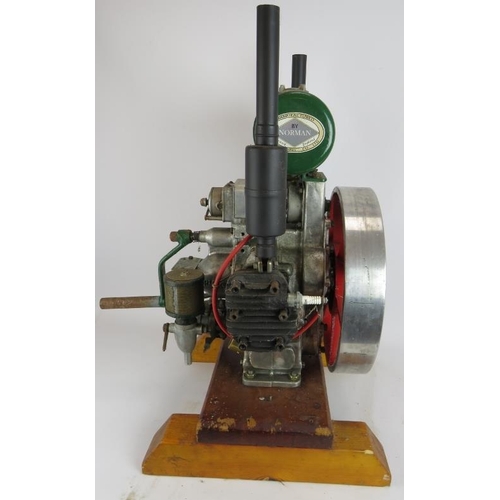 47 - A vintage Norman type T300 stationery engine on wood block mount. Height 68cm.
Condition report: Unt... 