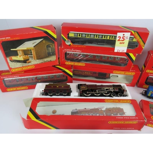 51 - A large quantity of Hornby 00 gauge railway carriages, track, rolling stock, buildings, locomotives ... 