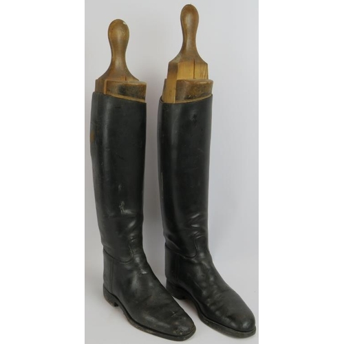 58 - A pair of vintage black leather riding boots with beech wood boot trees. Height 63cm. (pr).
Conditio... 