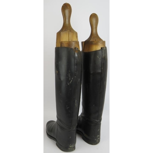 58 - A pair of vintage black leather riding boots with beech wood boot trees. Height 63cm. (pr).
Conditio... 