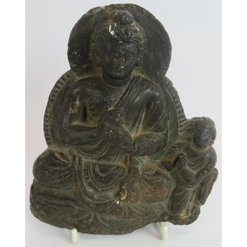 6 - An antique Indo-Greek carved hardstone figure of a seated Buddha with a praying attendant. Indian su... 